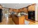 Gourmet kitchen featuring custom cabinets, a center island with bar seating, and modern appliances at 2841 Landing Dr, Marietta, GA 30066