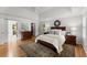 Beautiful main bedroom with hardwood floors, white walls and multiple windows for a bright, airy feel at 2841 Landing Dr, Marietta, GA 30066
