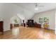 Spacious office area featuring hardwood floors, multiple windows, and a vaulted ceiling at 2841 Landing Dr, Marietta, GA 30066