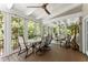 Bright sunroom with comfortable seating, ceiling fans and large windows overlooking greenery at 2841 Landing Dr, Marietta, GA 30066
