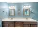 Beautiful bathroom featuring dual sinks, framed mirrors, and modern lighting fixtures at 3625 Stonehenge Ne Way, Marietta, GA 30066