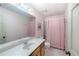 Bathroom with a single sink vanity, medicine cabinet and a combination tub and shower at 3625 Stonehenge Ne Way, Marietta, GA 30066