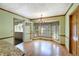 Bright dining room with hardwood floors, chandelier, and windows with custom valances at 3625 Stonehenge Ne Way, Marietta, GA 30066
