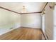 Dining room with hardwood floors, decorative trim, and window with valance at 3625 Stonehenge Ne Way, Marietta, GA 30066