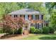 Charming brick home with black shutters, mature trees, and well-manicured landscaping at 3625 Stonehenge Ne Way, Marietta, GA 30066