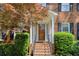 Close-up of the front porch of a brick home, with stairs and lush landscaping at 3625 Stonehenge Ne Way, Marietta, GA 30066
