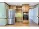 Eat-in kitchen with stainless refrigerator, built-in oven and microwave, and hardwood floors at 3625 Stonehenge Ne Way, Marietta, GA 30066