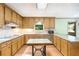 Kitchen features wooden cabinets, granite countertops, stainless appliances, and kitchen island at 3625 Stonehenge Ne Way, Marietta, GA 30066