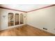 Living room with wood floors, arched doorways, and wall sconces for ambient lighting at 3625 Stonehenge Ne Way, Marietta, GA 30066