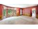 Spacious living room featuring a bay window, access to a deck, and hardwood floors at 3625 Stonehenge Ne Way, Marietta, GA 30066