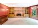 Bright living room features a brick fireplace, built-in bookshelves, and a large bay window at 3625 Stonehenge Ne Way, Marietta, GA 30066