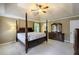 Large primary bedroom with a four-poster bed, carpet flooring, and large dresser at 3625 Stonehenge Ne Way, Marietta, GA 30066