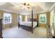 Spacious bedroom with trey ceiling, plush carpet, and large windows for natural light at 3625 Stonehenge Ne Way, Marietta, GA 30066