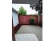 The backyard features a brick wall, privacy fence, and mulch bedded planting area at 401 Courtyard Ter, Woodstock, GA 30189
