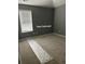 Cozy bedroom featuring plush carpeting, neutral walls, and window with horizontal blinds at 401 Courtyard Ter, Woodstock, GA 30189