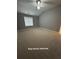 Large primary bedroom featuring plush carpeting, neutral walls, and vaulted ceiling at 401 Courtyard Ter, Woodstock, GA 30189
