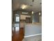 Open kitchen features wooden floors, gray walls, and stainless steel appliances at 401 Courtyard Ter, Woodstock, GA 30189