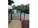 Community pool secured by a wrought iron fence at 401 Courtyard Ter, Woodstock, GA 30189