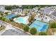 Aerial view of a community featuring a swimming pool, clubhouse, and tennis courts at 5365 Radford Loop, Fairburn, GA 30213