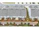 Aerial view of the back of townhomes with fenced yards and patios at 5365 Radford Loop, Fairburn, GA 30213