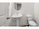 Cozy half bath with pedestal sink at 5365 Radford Loop, Fairburn, GA 30213