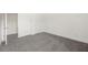 Bedroom featuring carpeted floors and ample closet space at 5365 Radford Loop, Fairburn, GA 30213