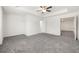 Large primary bedroom featuring carpeted floors and tray ceiling at 5365 Radford Loop, Fairburn, GA 30213
