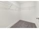 Walk-in closet features wire shelving and gray carpet floors for organized storage at 5365 Radford Loop, Fairburn, GA 30213
