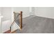 Hallway with wooden banister and gray carpet floors leading to additional rooms at 5365 Radford Loop, Fairburn, GA 30213