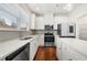 Contemporary kitchen with white cabinets, stainless appliances, and sleek countertops at 5365 Radford Loop, Fairburn, GA 30213