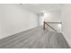 Second floor loft with carpeted floors and wrought iron railing at 5365 Radford Loop, Fairburn, GA 30213