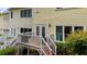 Backyard with deck, overlooking manicured landscaping and flowering bushes at 8555 Hope Mews Ct, Sandy Springs, GA 30350