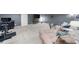 Large basement with neutral carpet, comfortable sofa, TV, and exercise equipment at 8555 Hope Mews Ct, Sandy Springs, GA 30350