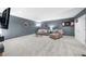 Finished basement offering comfortable seating, TV, decor, and a neutral carpet at 8555 Hope Mews Ct, Sandy Springs, GA 30350