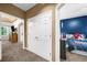 Hallway with bedrooms on either side and features white doors and neutral-colored carpet at 8555 Hope Mews Ct, Sandy Springs, GA 30350