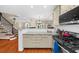 Modern kitchen with open design, stainless steel appliances, and hardwood floors at 8555 Hope Mews Ct, Sandy Springs, GA 30350