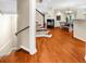 Open-concept living space with beautiful hardwood floors and staircase at 8555 Hope Mews Ct, Sandy Springs, GA 30350