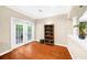 Bright sitting room with hardwood floors, French doors, and a view of the staircase at 8555 Hope Mews Ct, Sandy Springs, GA 30350
