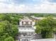 Aerial view showcasing the building surrounded by lush greenery, with nearby railways and residential area at 964 Dekalb Ne Ave # 112, Atlanta, GA 30307