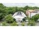 An aerial shot of the property, exhibiting the rooftop terrace and the tree-lined neighborhood at 964 Dekalb Ne Ave # 112, Atlanta, GA 30307