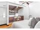 Charming bedroom loft space with hardwood floors, a desk area and exposed ceiling offers a unique living experience at 964 Dekalb Ne Ave # 112, Atlanta, GA 30307