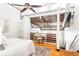Bedroom with a desk area, hardwood floors and exposed ceiling beams creates a stylish and functional living space at 964 Dekalb Ne Ave # 112, Atlanta, GA 30307