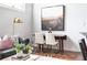 Cozy dining area perfect for intimate gatherings with a lovely painting on the wall at 964 Dekalb Ne Ave # 112, Atlanta, GA 30307
