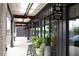 Storefront featuring signage, glass windows, lush greenery, and an A-frame sign to attract customers at 964 Dekalb Ne Ave # 112, Atlanta, GA 30307