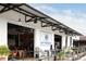 Inviting patio area featuring open garage doors that lead inside, comfortable seating, and ample natural light at 964 Dekalb Ne Ave # 112, Atlanta, GA 30307