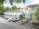 View of the building exterior showcasing the modern architecture and ample parking space at 964 Dekalb Ne Ave # 112, Atlanta, GA 30307
