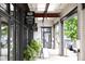 Exterior storefront with signage, black framed windows, and decorated with lush greenery, including a bakery and salon at 964 Dekalb Ne Ave # 112, Atlanta, GA 30307