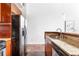 Modern kitchen with stainless steel appliances, wooden cabinetry and granite countertops at 964 Dekalb Ne Ave # 112, Atlanta, GA 30307