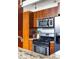 Modern kitchen with stainless steel appliances and wood cabinets offers contemporary style and functionality at 964 Dekalb Ne Ave # 112, Atlanta, GA 30307