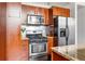 Modern kitchen with stainless steel appliances, wooden cabinetry and granite countertops at 964 Dekalb Ne Ave # 112, Atlanta, GA 30307